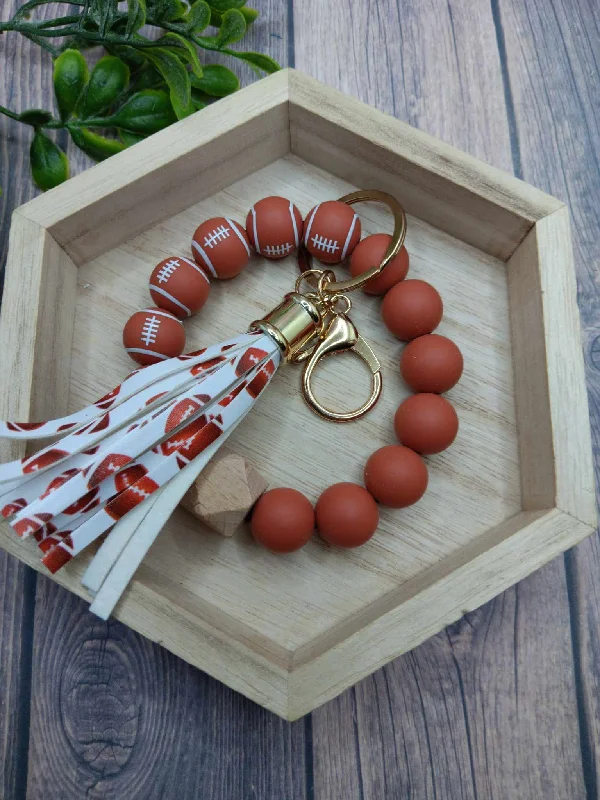 Christmas Celebration Football Beaded Wristlet w/ Tassel