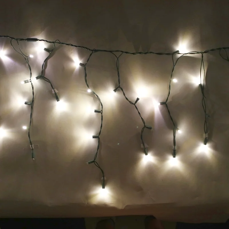Christmas Family Traditions 100-light Warm White 5mm LED Icicle Lights, Green Wire